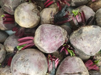 Stacks of Red Beet or Beta vulgaris in boxes at the market. Dinner Beet. Table Beet. Garden Beet.