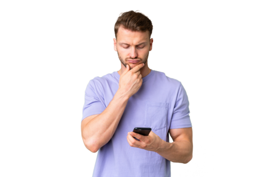 Young handsome caucasian man over isolated chroma key background thinking and sending a message