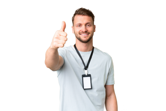 Young caucasian man with ID card over isolated chroma key background with thumbs up because something good has happened