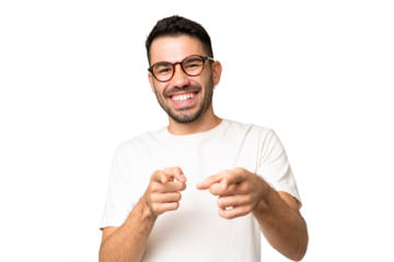 Young handsome caucasian man over isolated chroma key background pointing to the front and smiling