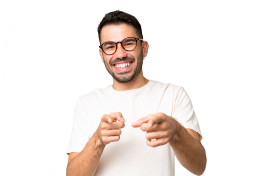 Young handsome caucasian man over isolated chroma key background pointing to the front and smiling