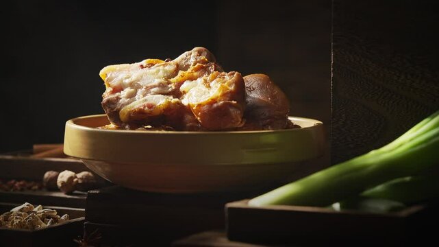 Special Chinese braised pork knuckle on a dark background
