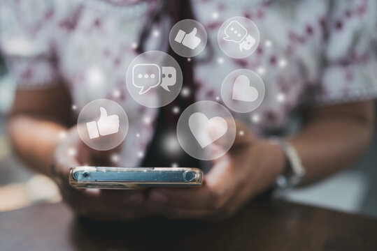 A woman engaging on social media with floating emoji icons. Concept of digital marketing, online engagement, social influence, and modern communication.