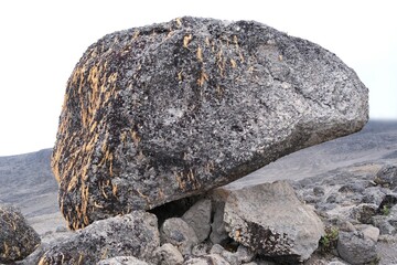 Volcanic rocks covered with lichens in misty scenery of Kilimanjaro, Machame Route, trail from Shira Camp to Barranco Hut, Tanzania © Iwona