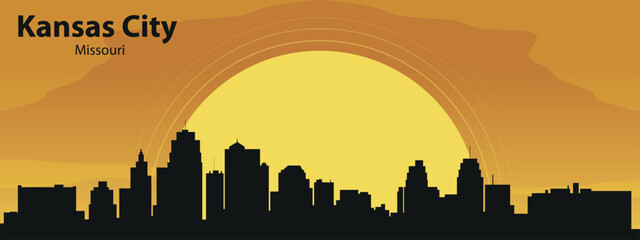 Silhouette of the Kansas, Missouri city skyline against the background of the Big Yellow Sun and yellow sky