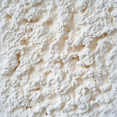 Textured White Plaster Surface with Rough Stucco Finish for Creative Background or Industrial Design
