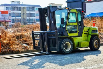 big green forklift outdoors