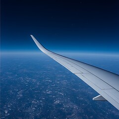 Obraz premium Airplane wing soaring through the expansive blue atmosphere above the earth