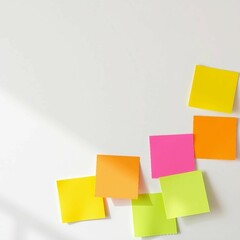 Fototapeta premium Bunte Haftnotizen auf weißem Hintergrund. Ideal für Notizen oder Erinnerungen. Platz für Text. Helle, fröhliche Farben.