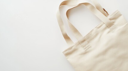 Sturdy beige canvas tote bag with extended handles for everyday use on plain white background