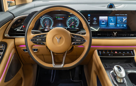 Voyah Dream luxury minivan beige interior, shift gears, steering wheel, dashboard. Interior of the warm beige electric minibus new Voyah Dream. Dongfeng Motor Corporation. 