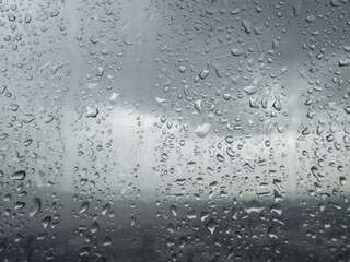 Close up of water droplets on a glass window during the day