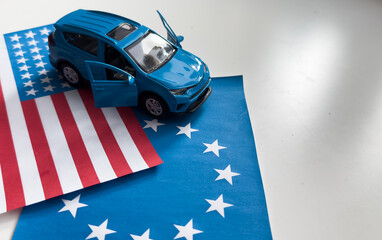 Toy cars and flags of the United States and the European Union