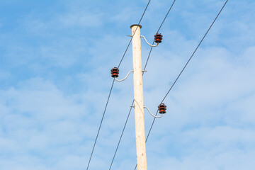 electricity pole on the blue sky background .