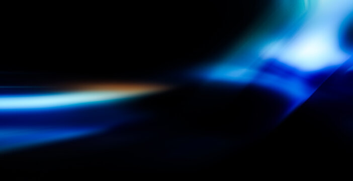 Colorful glow sparks of light texture. Orange bluerays on dark blue abstract layer black background .Crystal flare abstract effect. Holographic sunlight reflection wallpaper, colorful glare bokeh.