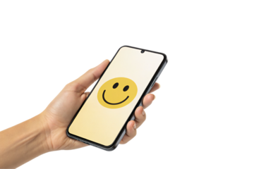 A hand holds a smartphone displaying a cheerful yellow smiley face. The clean background and simple design evoke positivity, friendliness, isolated on a transparent background