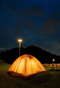 Camping Tent with at night time with mountain view. Outdoor activity and lifestyle.