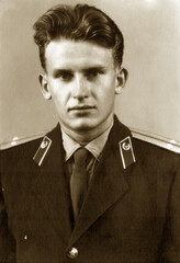 Vintage portrait of a young lieutenant in military uniform. Retro photo from 1961