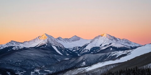 Obraz premium Snow-Capped Mountains at Sunset