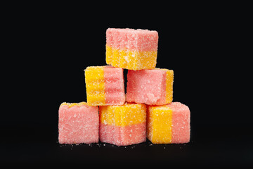 Marmalade isolated on black. Multicolored jelly sweets. Sweets for everyone