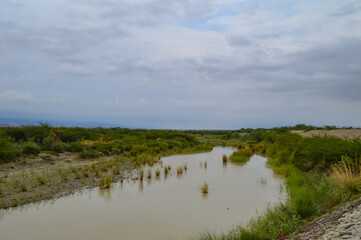 outdoor blue cloudy sky landscape with river and clouds