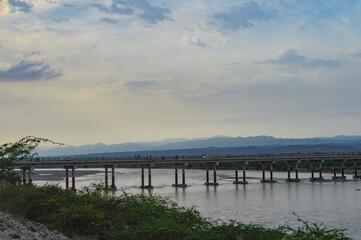Obraz premium bridge on the river landscape water flowing