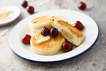 Banana cottage cheese cakes with cherries and almond