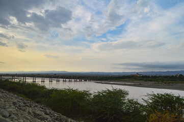 Turbat city bridge river and clouds