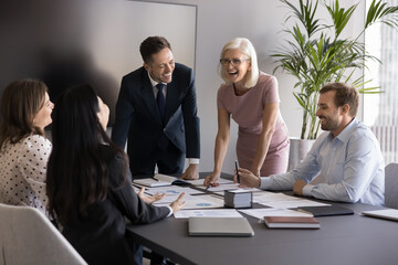 Team reviewing paperwork, collaborate in boardroom, reviewing documents, brainstorming creative...