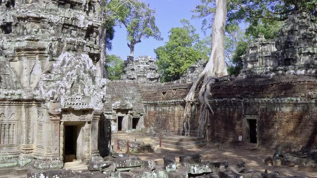 Angkor Wat, A remarkably tall building set against dense jungle backdrop
