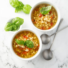 Vegan lentils soup with fresh basil