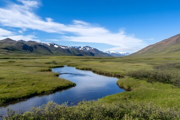 Serene landscape with winding stream, mountains, and a clear sky