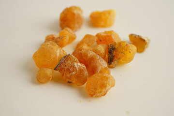Frankincense or olibanum aromatic resin isolated on white background used in incense and perfumes.