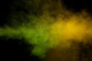 Yellow and green steam on a black background.