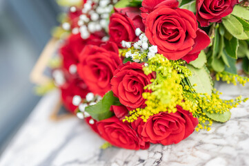 A Burst of Red Roses: Romantic Bouquet with Delicate White and Yellow Accents, Celebrating Love and Beauty, A Close-Up View of Floral Elegance