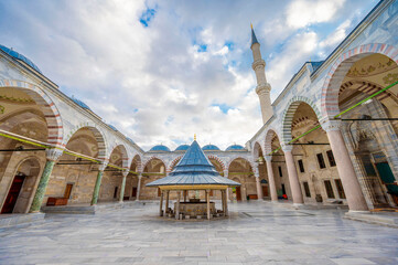 Istanbul,  Turkey- 9 22 2019: Fatih's mosque
Majestic view of the serene courtyard and ablution fountain of Fatih Mosque in Turkey showcasing Ottoman architecture with grand arches domes