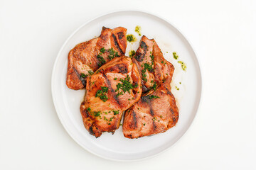 Fototapeta premium Grilled chicken on a plate with herbs, delicious meat cuisine for dinner and cooking inspiration