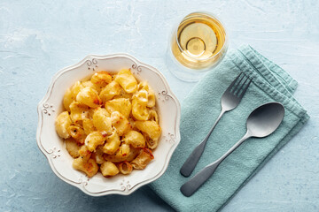 Mac and cheese, the classic pasta with macaroni and Cheddar cheese, baked in the oven, overhead...