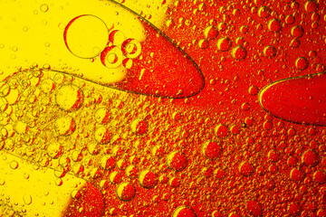 Macro red and yellow oil drop texture,Unique and beautiful macro shots of oil on water with colored backgrounds