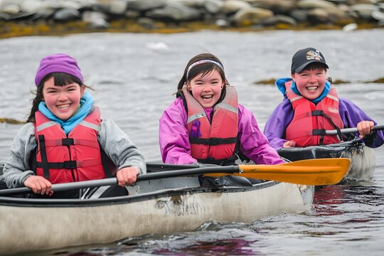 Three smiling children paddling together in a canoe on the water - Powered by Adobe