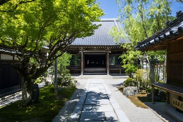 Fototapeta premium Traditional building nestled in serene garden, tiled roof, stone path