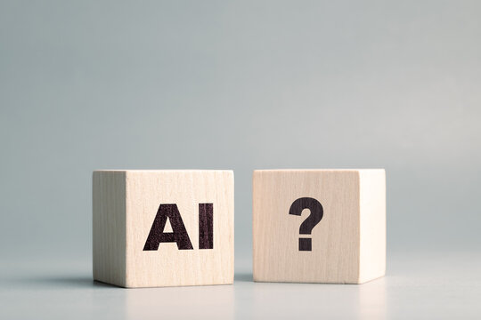 AI text and Question mark symbol on the wooden cubes, confusion about AI, how to use, and ask, questions about AI technology