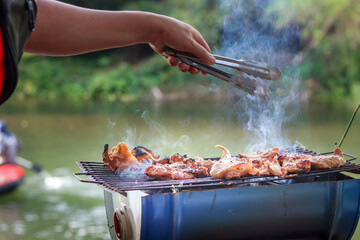 hand Grill the meat on the grill on holiday