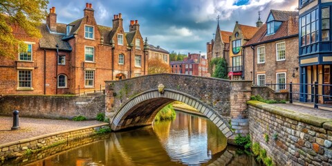 Obraz premium A small stone and brick bridge over a stream in the historic city of Norwich, England, with a pedestrian crossing through the center, historic city, architecture