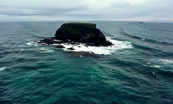 aerial view from flying drone of rocky island in Atlantic ocean