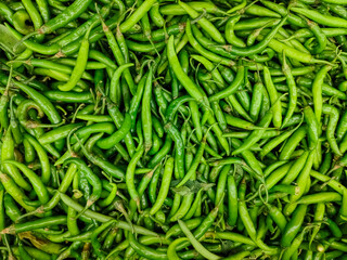 Chili peppers, also spelled chile or chilli (from Classical Nahuatl chilli), are varieties of berry-fruit plants from the genus Capsicum, fresh green chillies, red cayenne, Birds eye chilli.
