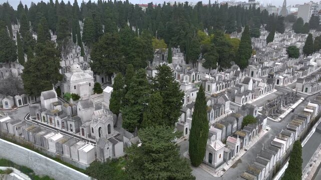 Portuguese cemetery Prazeres in Lisbon, Portugal in Foggy cloudy misty Weather, Aerial Drone shot