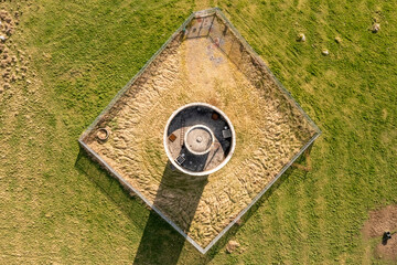 Top-down aerial view of Clarinbridge's large cylindrical water tower, Galway, Ireland
