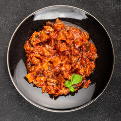 Eggplant stew dish vegetables salad tasty fresh delicious gourmet food background on table rustic food top view copy space keto and paleo diet vegetarian and vegan food