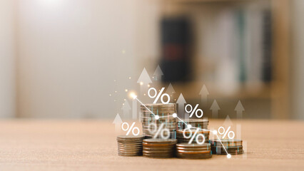 Saving money wealth concept. Stack of silver coins with up arrow. driven by higher interest rates...